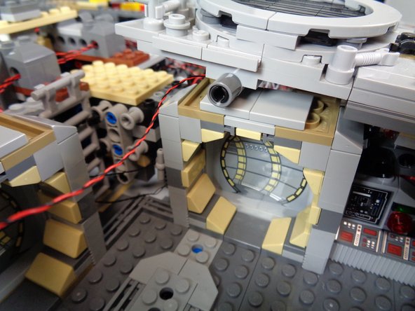 Run the LED light wire into the right rear space, close to the BRANCH09X adapter board.