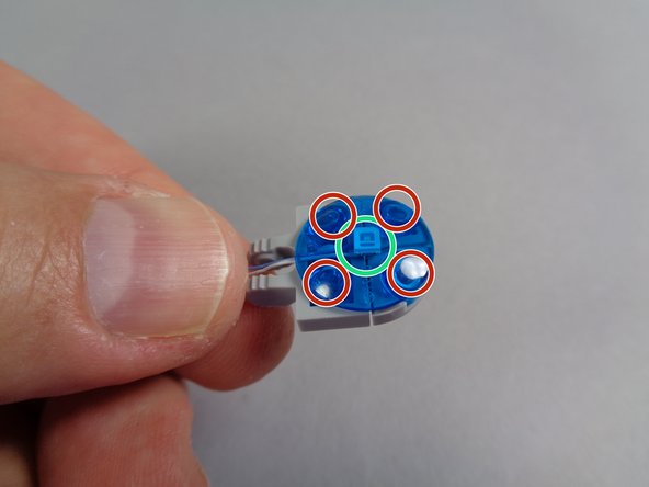 As shown by the blue line in the second photo, make sure the LED light is positioned in the center of the plate, and that the LED itself (the small white rectangle) sticks up a small amount beyond the plate.  Hold the LED in place with your finger.