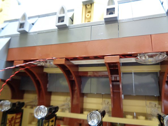 The second photo shows the results after the light wires have been secured between the roof and roof braces.