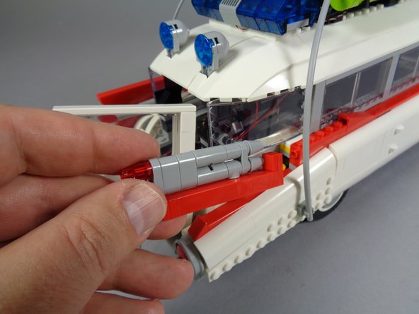 Next, you will mount two LED lights into the rear right tail light.