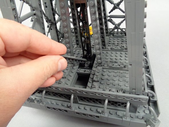 As shown in the third photo for this step, also remove the 1x8 plate in the base.