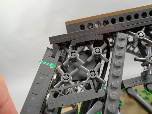 As shown in the photos for this step, repeat the same process to slide the second light strip into the pillar interior, then down the pillar to attach to the outer edge, facing inward toward the first light strip.