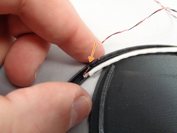 As shown by the green arrows in the first photo for this step, you'll need to fold the wire for the LED strip underneath the strip to mount.