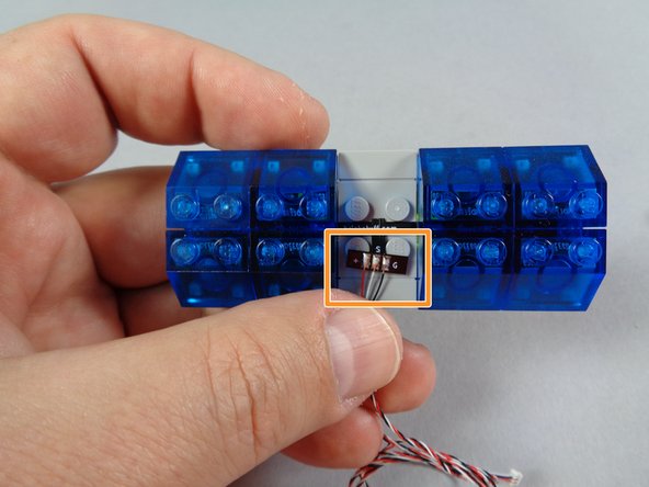 As shown by the orange rectangle in the first photo for this step, one side of the lightbar will have a &quot;T&quot; shaped flexible circuit board with wires attached.