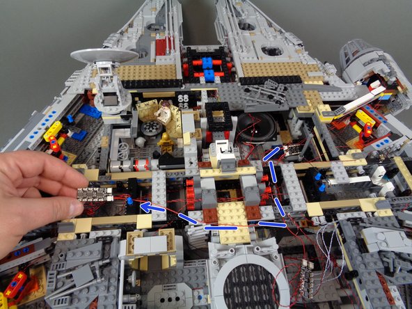 As shown in the second photo, take the last BRANCH09X adapter board from the Main Control and Connecting Parts bag, and connect the other end of the red wire to the INPUT plug on the third BRANCH09X adapter board.