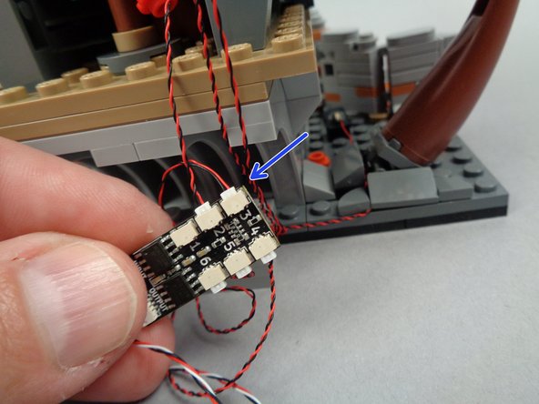 As shown in the first and second photos for this step, take the light wire for the blackboard light and connect it to plug #3 on the BRANCH06X driver board.