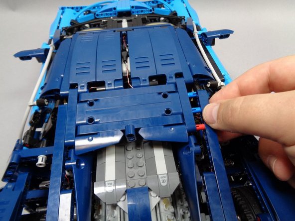 If you will be attaching the spoiler add-on kit, skip to Step 41 to connect those lights before closing up your Bugatti, then come back to this step.