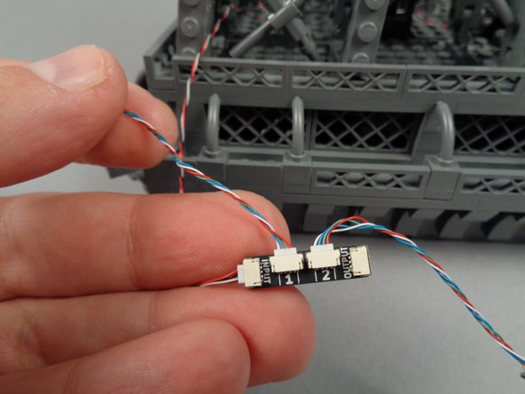 As shown in the first photo for this step, you will begin with the LED light strips connected to plug #1 on the adapter board.