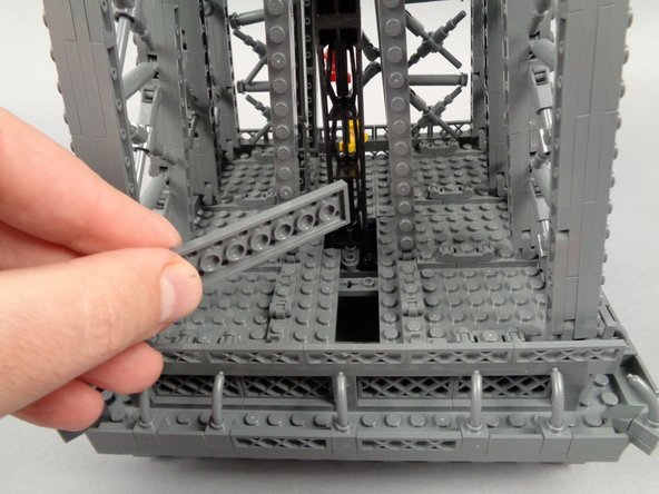 Remove the 2x8 plate as shown in the second photo.