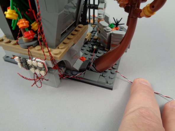 Replace the tree as shown in the second photo for this step.