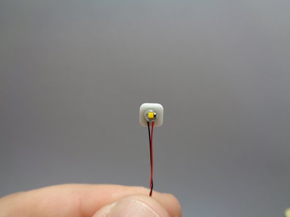 Take a warm white light from Bag 9 and attach a small sticky square to the back.