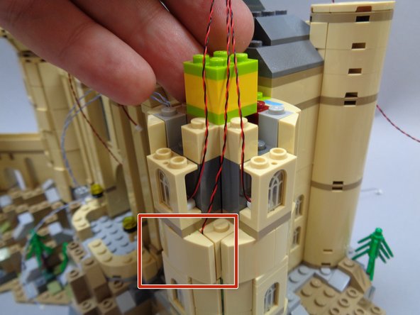 As shown in the third photo (red rectangle), carefully re-attach the slope parts above the lower window.