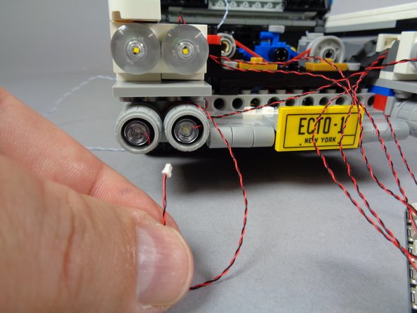 Repeat the earlier steps again to mount the LED light inside the fourth lower headlight.