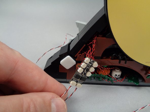 Use one of the large sticky squares to attach the BRANCH06X board.