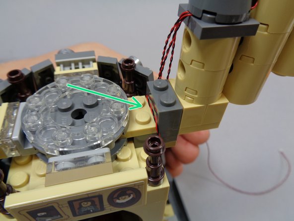 As shown in the first photo, remove the roof section under the three small towers.