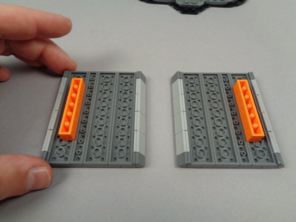 Position the two rooftop pieces as shown in the first photo for this step.