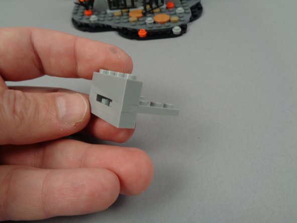 The photos for this step show how to use the five Light Bluish Gray parts from your &quot;Brick Parts&quot; bag to construct a support base for the wires.