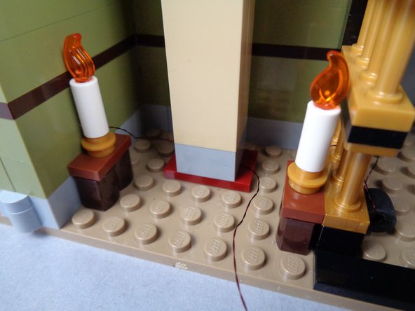 Re-attach the obelisk as shown in the third photo.