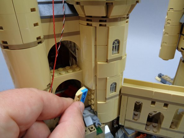 As shown in the first photo, remove the tree from the tower base.