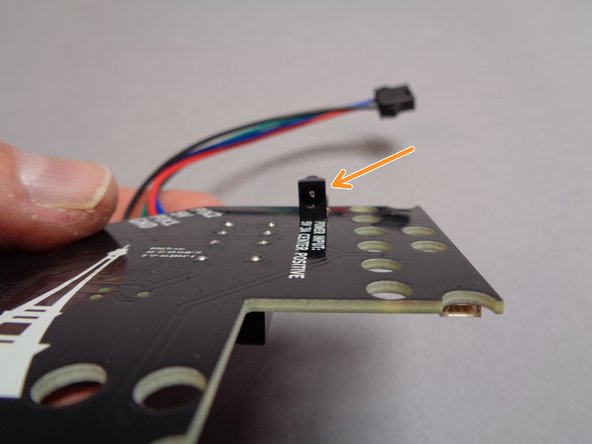 The second photo for this step shows the top of the main controller.  Note that four colored wires are attached to the white terminal blocks on the top right edge of the controller board.