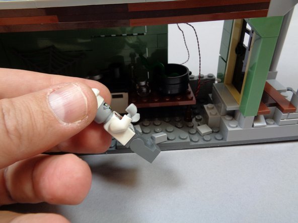 As shown in the third photo, remove the chef minifigure if you have it inside your kitchen.