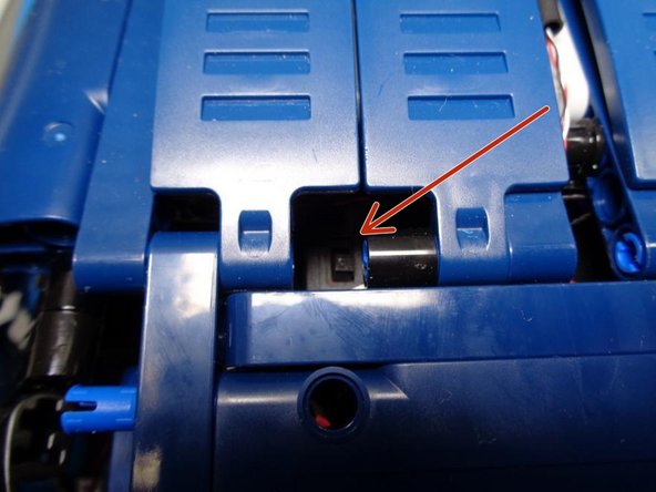 The battery pack fits perfectly in the flat space behind the seats and under the roof.  Connect the battery pack cable to the last open plug on the main control board (red square int he first photo).