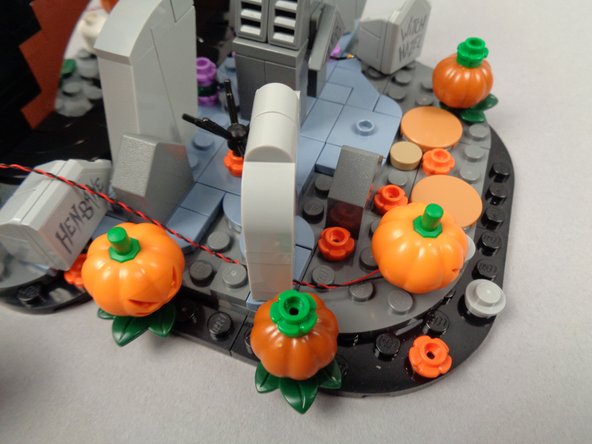 Continue running the light wire toward the back as shown in the third photo.