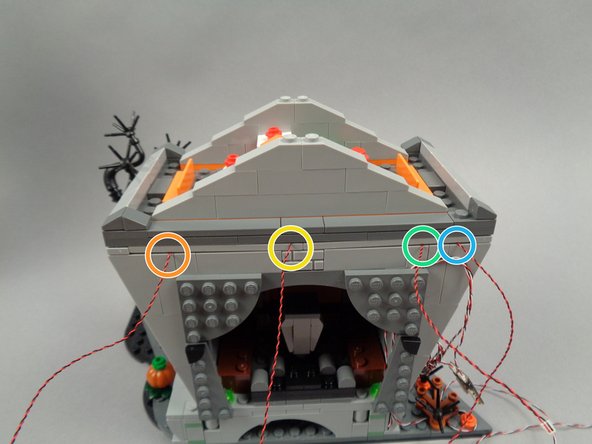 You should now have four light wires extending out the back of the town hall as shown in the second photo: