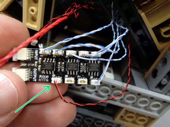 As shown  by the green arrow in the first photo, connect the wire for the green light to plug #9 on the BRANC09X adapter board.