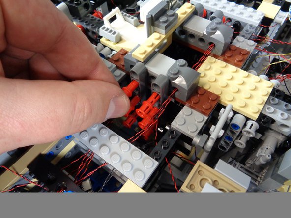 next you will remove the lower laser mount from the underside of the Falcon.