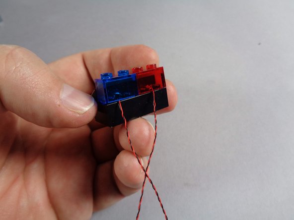 As shown in the second and third photos, repeat this process for the second light and transparent blue brick.