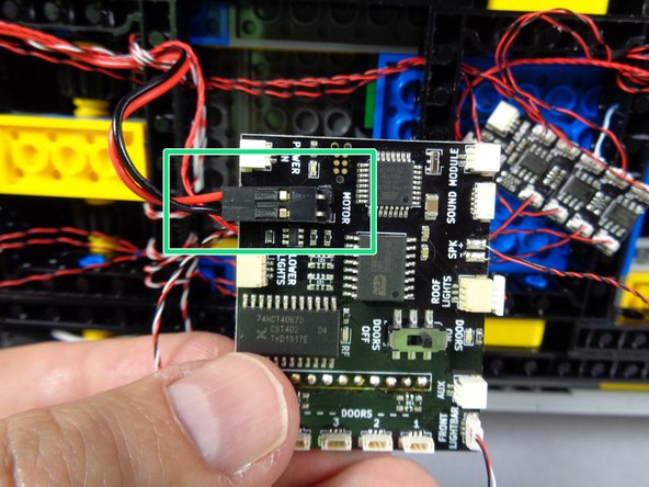 As shown by the green rectangle in the photo for this step, next you will connect the motor to the main controller.