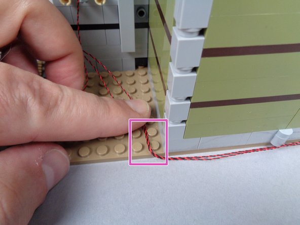 Make sure to have the mansion CLOSED when running the wires, as shown.  This ensures the wires will have enough &quot;play&quot; to allow the mansion to be opened and closed without damaging the wires.