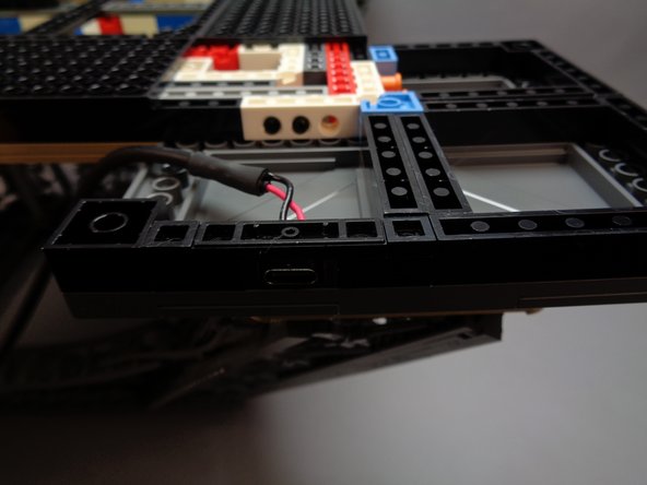 When placing the connector bracket, be careful not to press too hard and cause the top side of the tower frame to come loose.  It is a good idea to support the top side of the foot with one hand while pressing down on the bracket with your other hand.