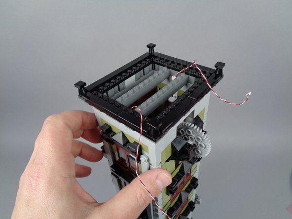 When you have finished re-attaching the roof, your setup should look like the third photo for this step.