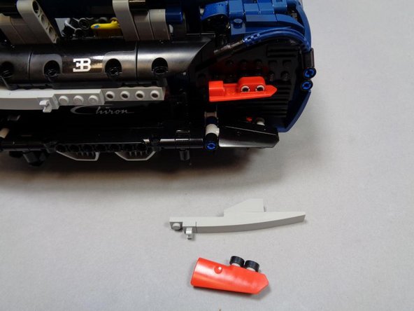 Dissemble the top half of the right rear turn signal and tail light bracket as shown in the first photo.