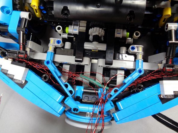 After mounting both headlights and routing the wires, check the three photos in this step to make sure you have the wires routed correctly.
