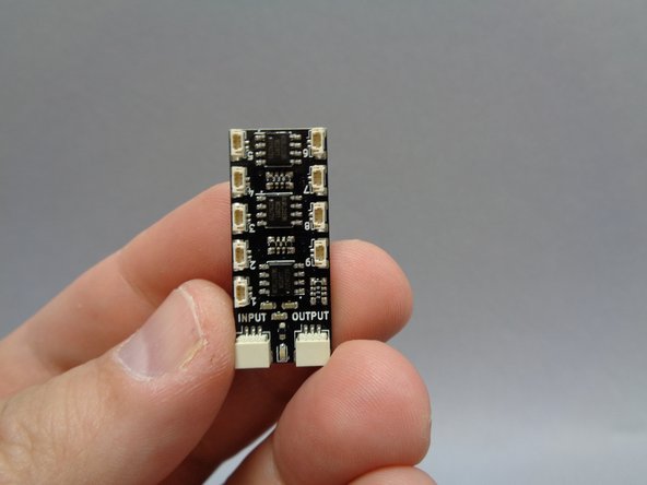 As shown by the red circle in the first photo, make sure the two wires pass BEHIND the horizontal floor support.