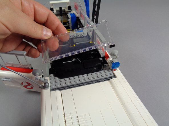 Next you will mount the small dashboard light.  Doing this now, while you have the roof removed, reduces the amount of disassembly needed to install your light kit.