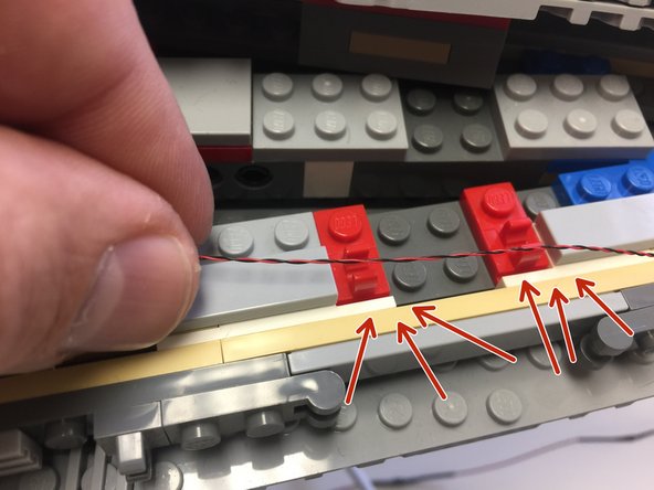 The second and third photos show a very important warning.  Do not let any light wires run through the center of any hinge clips (see the red arrows in the second photo)-- this will cause damage when the hinge tops are re-attached.