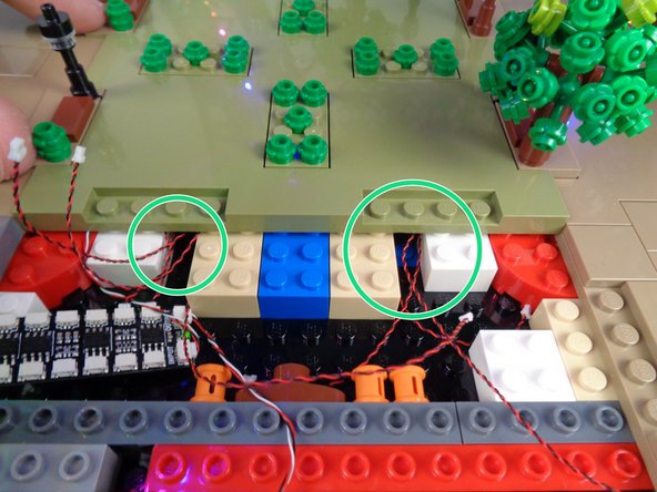 As shown in the first photo for this step, position Panel 3 to be re-attached but do not press down yet.