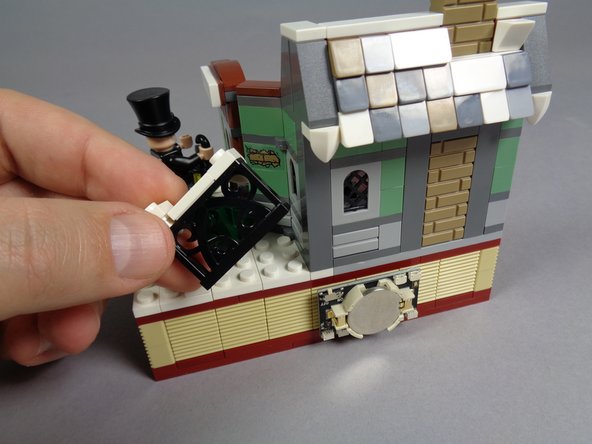 As shown in the first photo, remove the black gate.