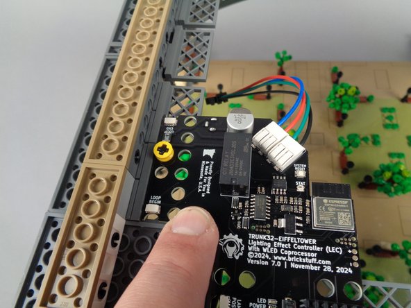 The main controller is specially designed to fit in the corner of the top of the tower base-- make sure it is positioned as shown in the first photo.