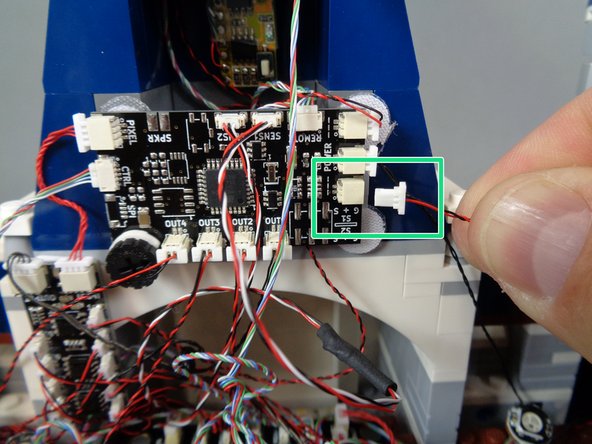 As shown by the green rectangle in the first photo, connect the larger white connector to the last open POWER plug on the TRUNK08 master controller.