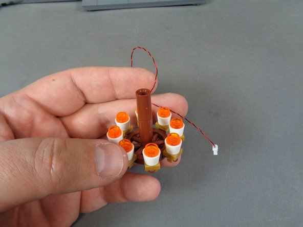 Inside the box labeled &quot;Chandelier,&quot; there is a pre-lit chandelier with eight lights and one connecting wire as shown in the first photo.