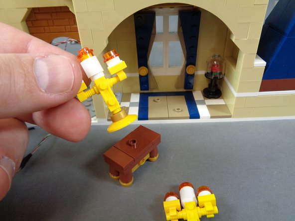 As shown in the second and third photos, remove the unlit candelabra and replace with the pre-lit version.