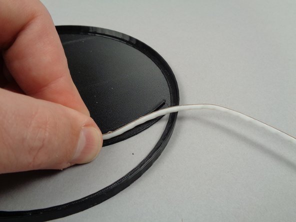 As shown in the photos for this step, continue routing the LED strip along the inside of the crescent moon frame with the LED portion of the strip (the white part) facing inward toward the exposed area of the frame.