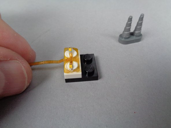 Depending on when your kit was manufactured, the color of the assembly may be yellow as shown in the photos, or it may be a another color.  The operation and installation will be the same.