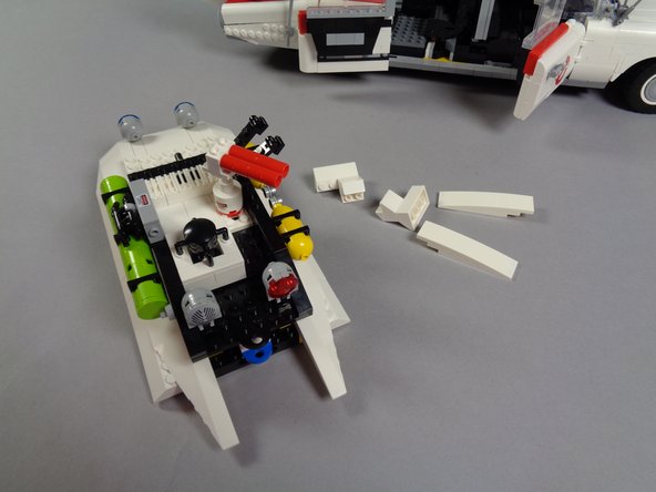 As shown in the photo for this step, the rear roof section will not separate without several white slopes detaching.  That is ok.