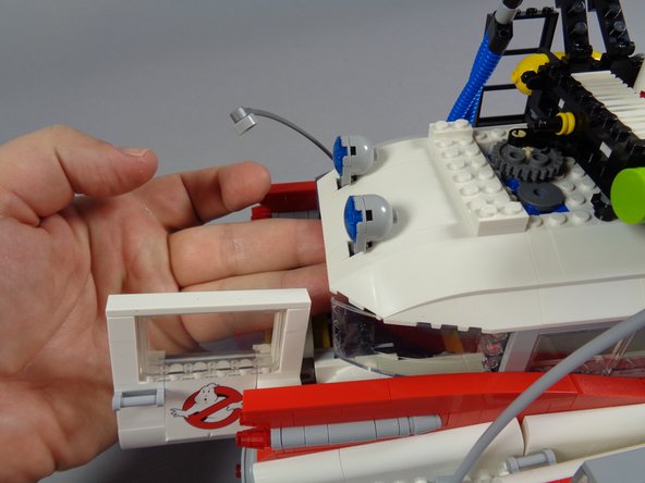 As shown in the first photo, open the side doors to allow better access to the underside of the roof.